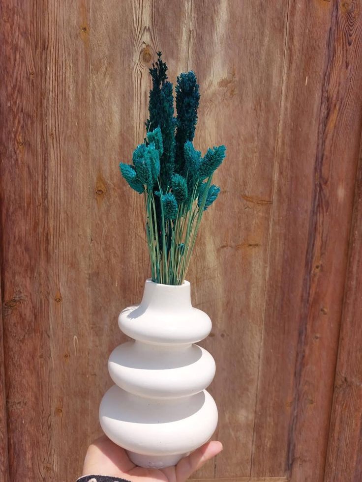 Three-tier white ceramic cloud bubble vase with teal dried flowers